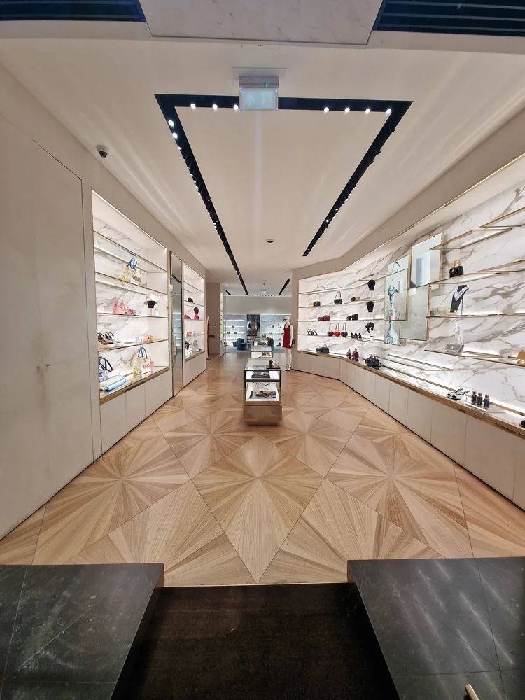 Backlit marble surfaces on the shop walls
