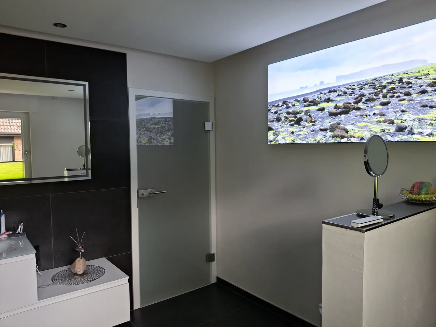 The same bathroom with a view of the mirror